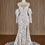 Thumbnail: Front view fitted wedding gown with lace bishop sleeves skirt slit sweetheart