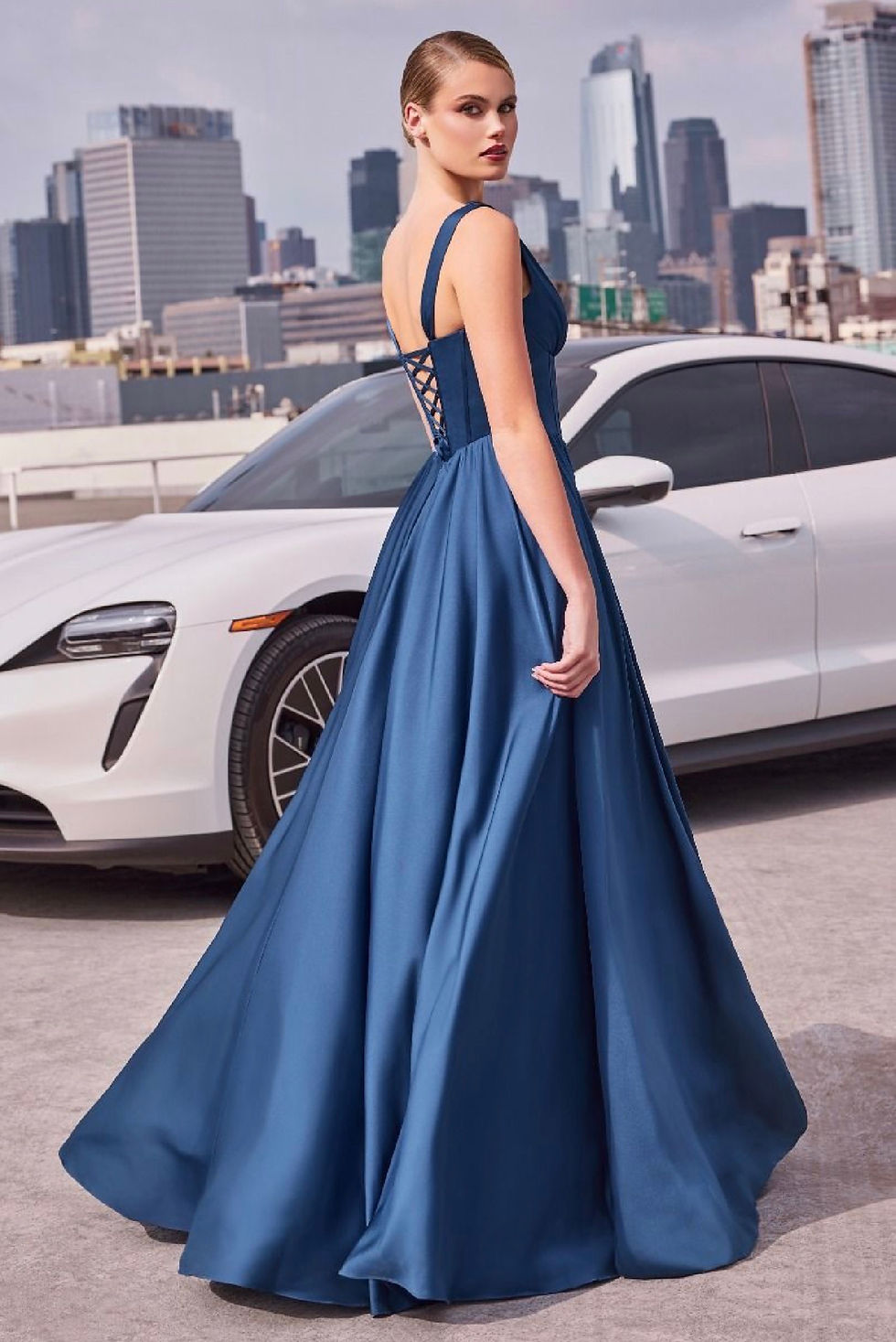 Thumbnail: navy soft satin a line dress for bridesmaids or summer wedding with wide straps and a corset bodice with a plunging neckline