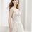 Thumbnail: front close up view lace and tulle a line wedding dress with beaded spaghetti straps a plunging neckline and a skirt slit