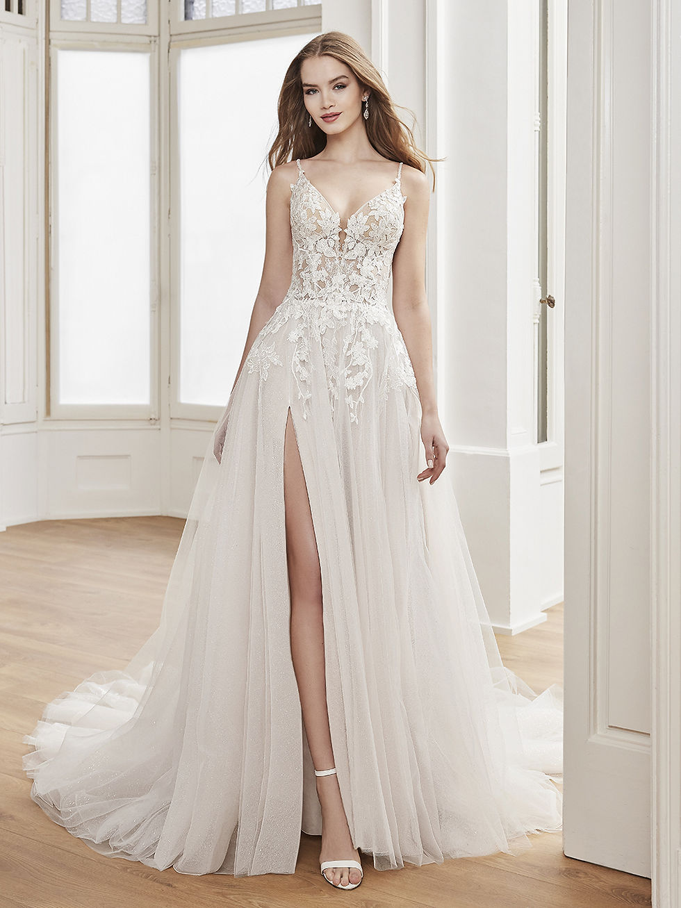 front view lace and tulle a line wedding dress with beaded spaghetti straps a plunging neckline and a skirt slit