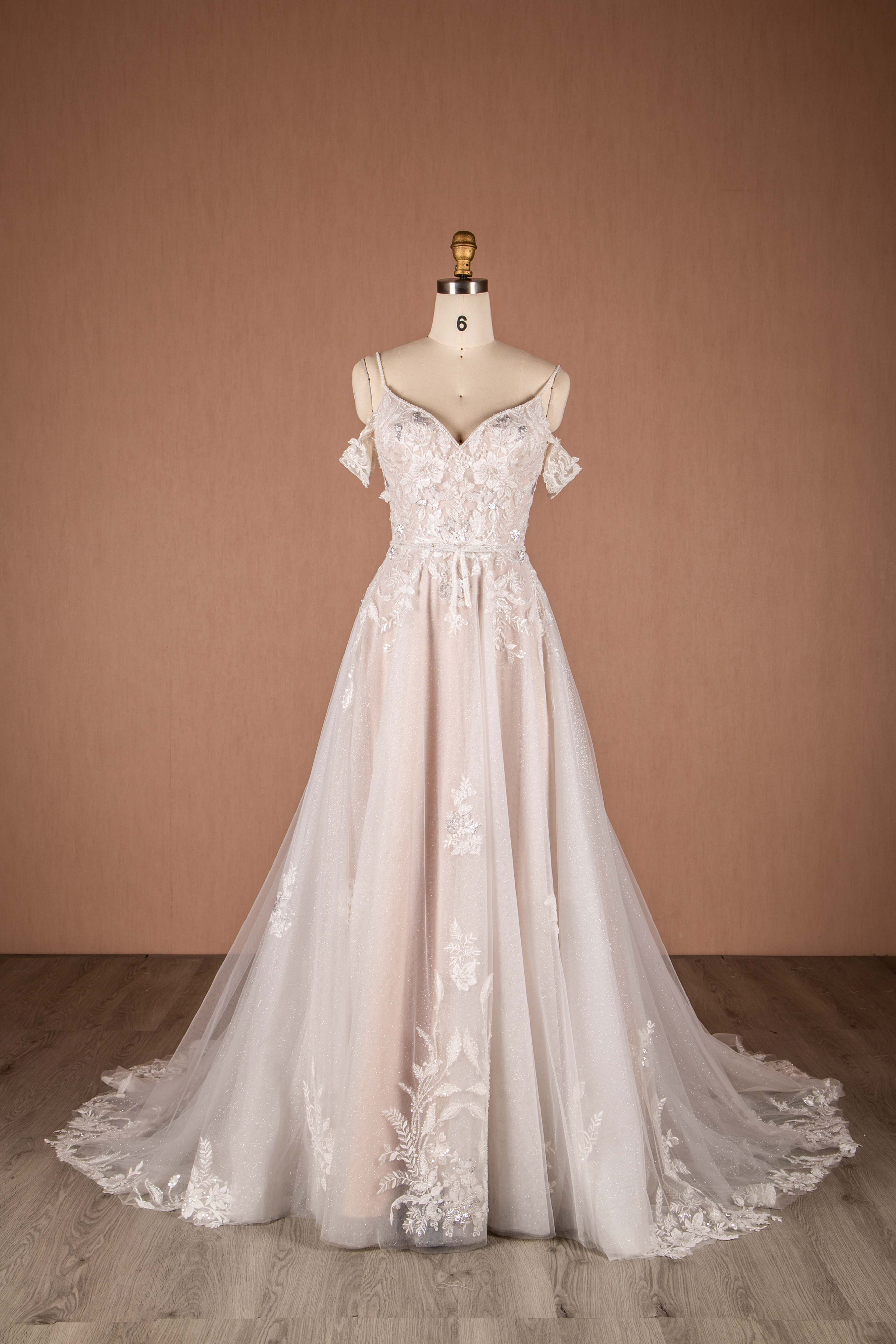 front view sparkly a-line bridal gown with spaghetti straps and off the shoulder sleeves