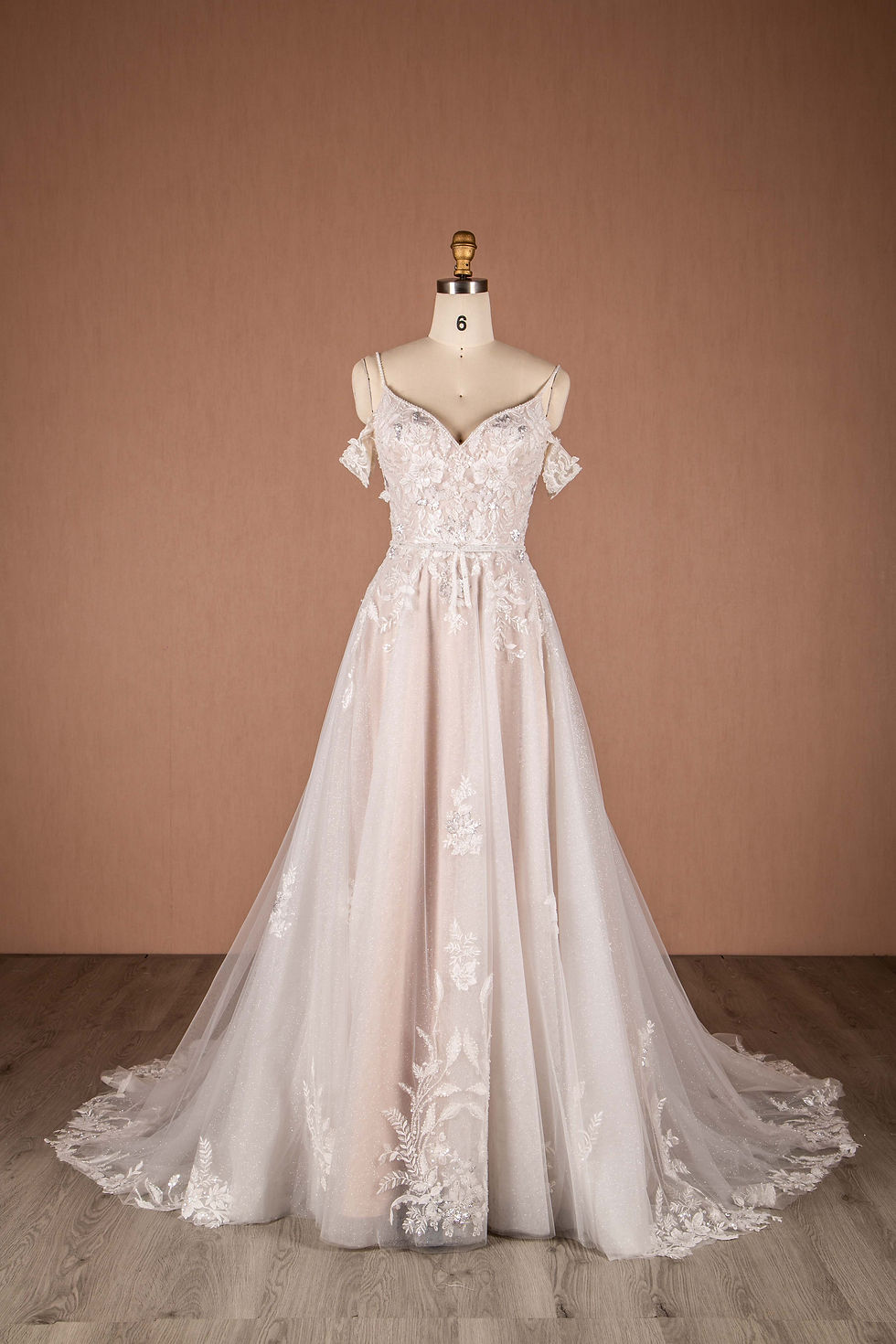 front view sparkly a-line bridal gown with spaghetti straps and off the shoulder sleeves