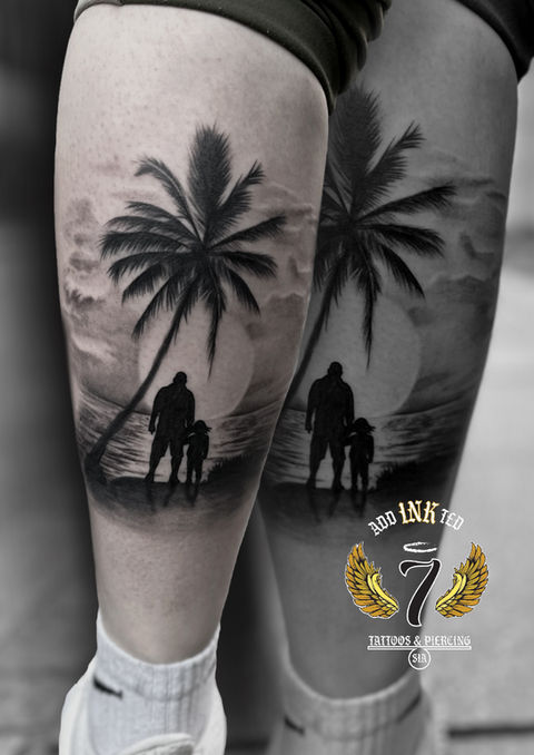 Silhouette tattoo of two people under palm tree at the beach with sunset.
