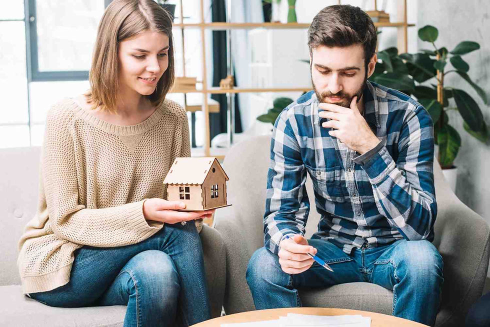 A young man and woman discussing reverse mortgage and downsizing.