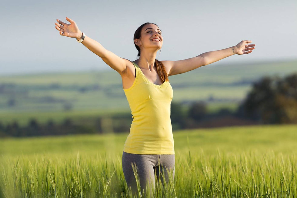 A young woman enjoying stillness in fresh morning green environment