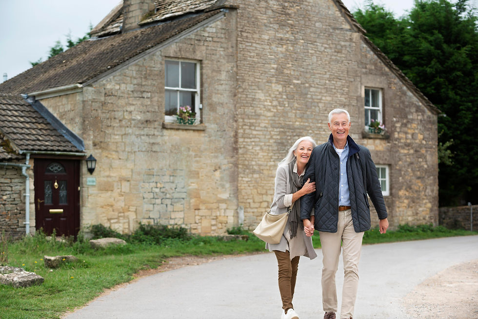 a senior happy couple outside their home after learning about reverse mortgage in Canada