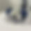 Thumbnail: Three 6Degrees wearable motion sensor devices displayed on clear stands, featuring two blue devices and one white device, each with an adjustable wrist strap.