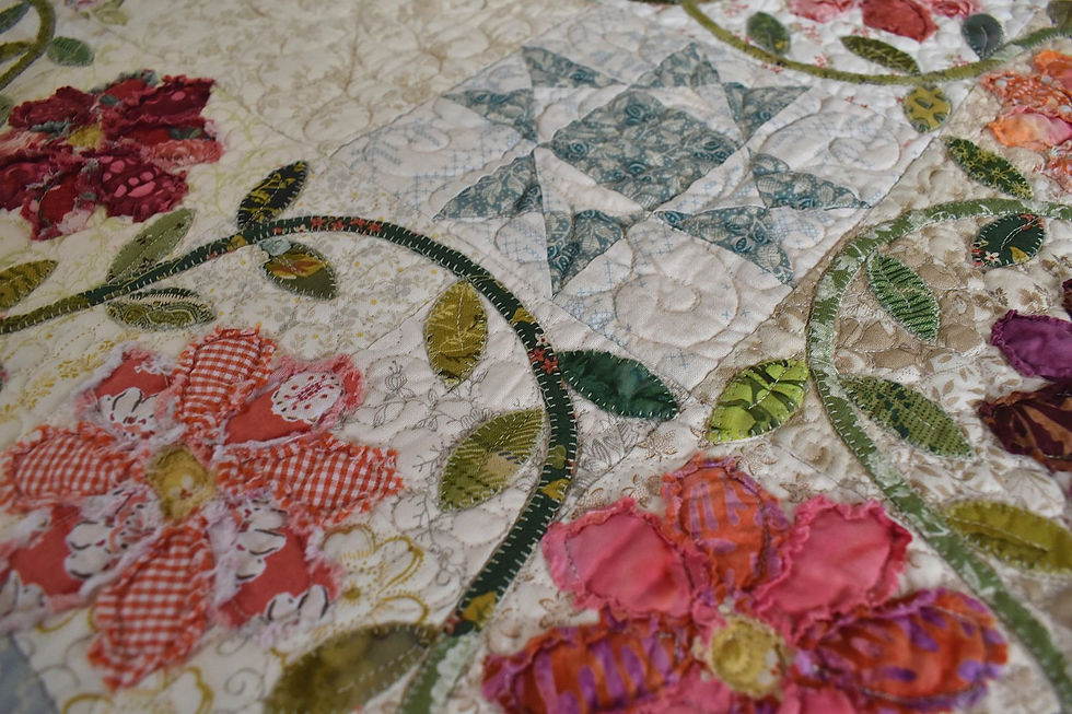 Thumbnail: Detailed view of applique flowers from the Once Upon a Time quilt pattern