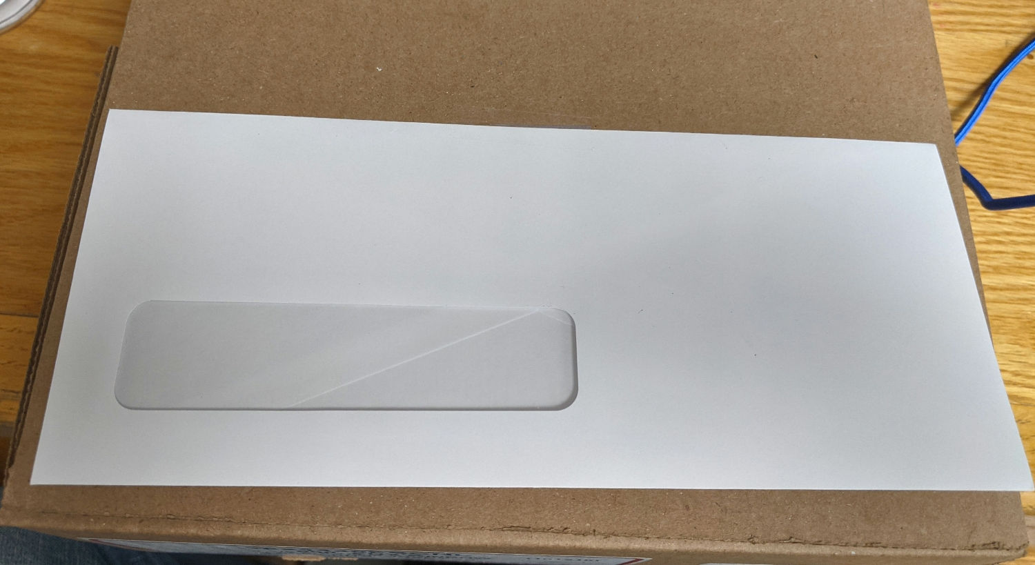 SupremeX 4⅛ x 9½ envelope with window. V-flap crossback