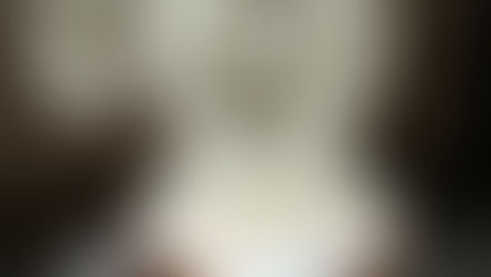 A steaming cup of tea sits on a table. Clock numbers and hands appear in the rising steam, creating a surreal effect. Warm, calm mood.