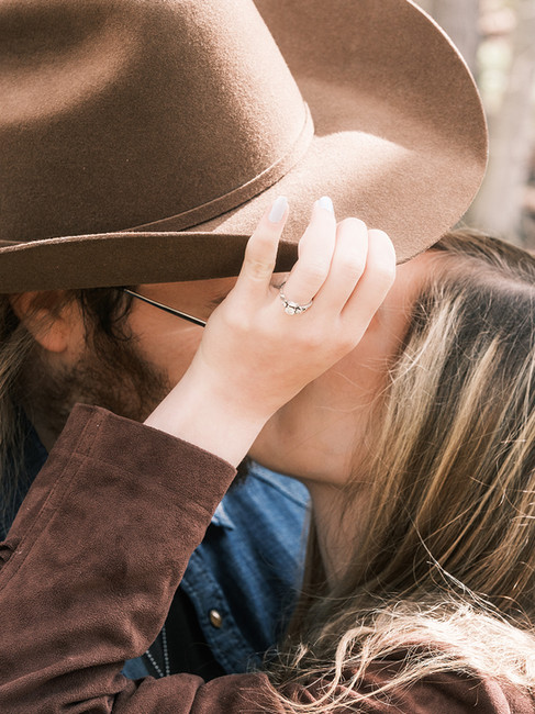 Close-up of a hat and rings during Rochester engagement session