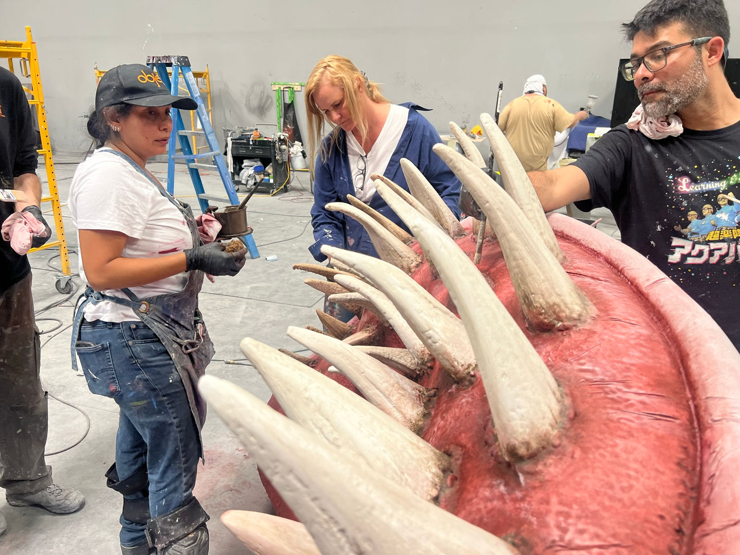 
Experiential fabrication, scenic paint, sculpting, captivating, remarkable project, expert team, menacing Meg shark, intricate scenic paint work, artistry, detailed scenic design, awe-inspiring installation, experiential masterpiece, legendary Meg, face-to-face, thrill.
