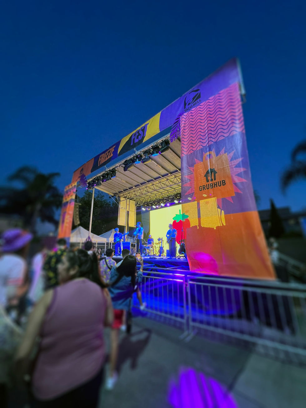 Larger-than-life stage banners featuring bold graphics and Taco Bell branding, creating a dynamic focal point and energizing the event space.