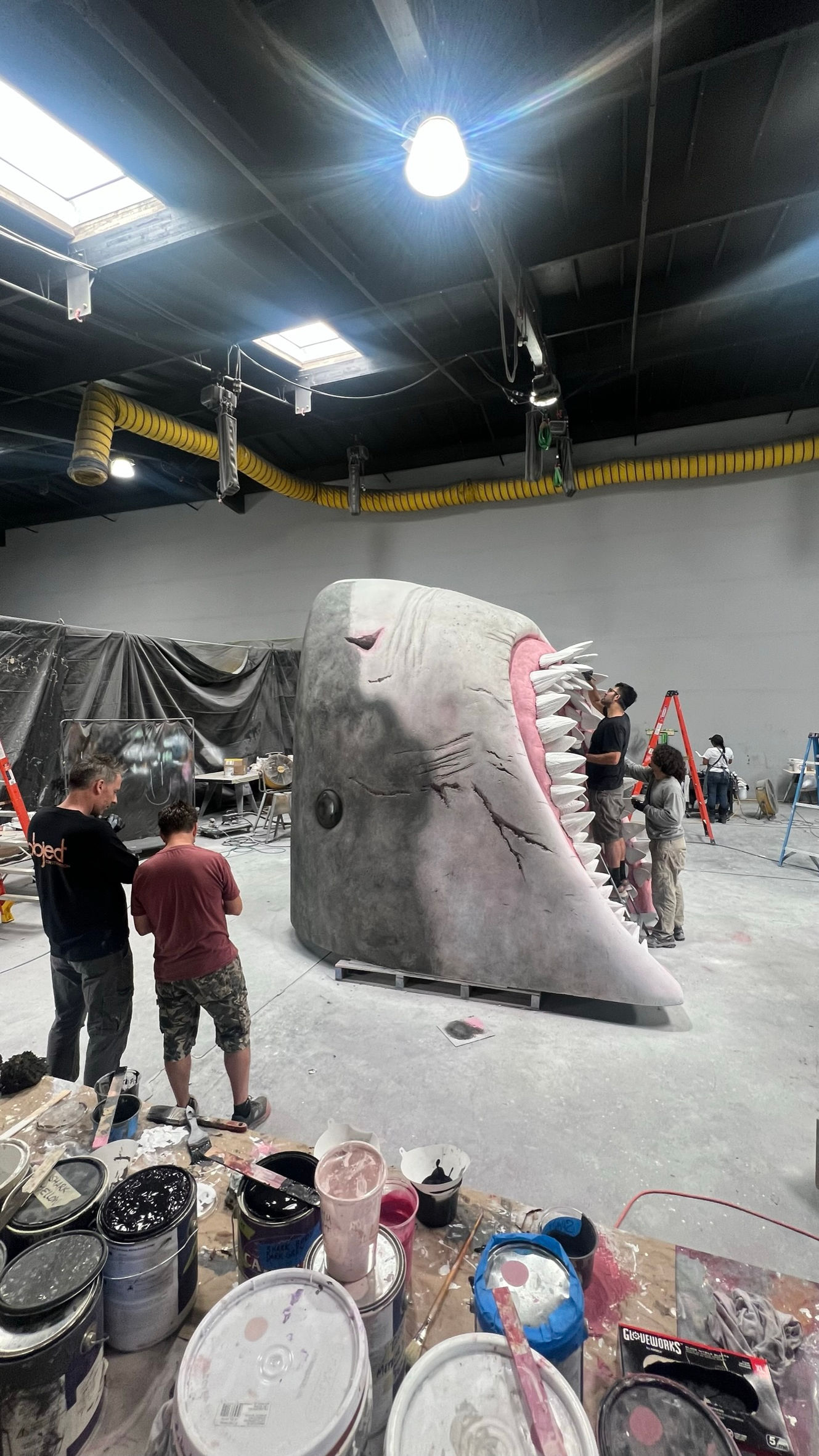 
Experiential fabrication, scenic paint, sculpting, captivating, remarkable project, expert team, menacing Meg shark, intricate scenic paint work, artistry, detailed scenic design, awe-inspiring installation, experiential masterpiece, legendary Meg, face-to-face, thrill.