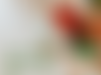 Festive holiday presents stacked under a decorated tree