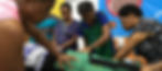 Nurses applying compression suit onto mother's legs during child birth