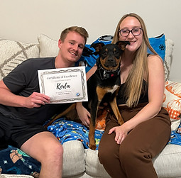 Happy client with dog after dog training classes