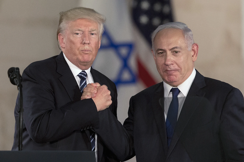 President Donald Trump and Israeli Prime Minister Benjamin Netanyahu shake hands at The Israel Museum in Jerusalem, May 23, 2017. (AP Photo/Sebastian Scheiner, File)