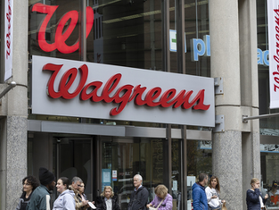 How did Walgreens exceed Wall Street's expectations and continue its turnaround plan?