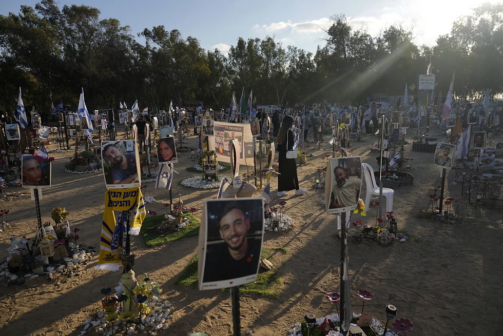People visit the site of the Nova music festival, where hundreds of revelers were killed and abducted by Hamas and taken into Gaza, on the first anniversary of the attack, near Kibbutz Reim, southern Israel, Oct. 7, 2024. (AP Photo/Ariel Schalit, File)