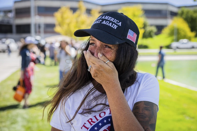 Allison Hemingway-Witty cries after Charlie Kirk is shot during Turning Point’s visit to Utah Valley University in Orem, Utah, Wednesday, Sept. 10, 2025. (Tess Crowley/The Deseret News via AP)