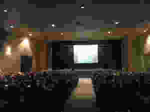 Students in the auditorium listening to a presenter.