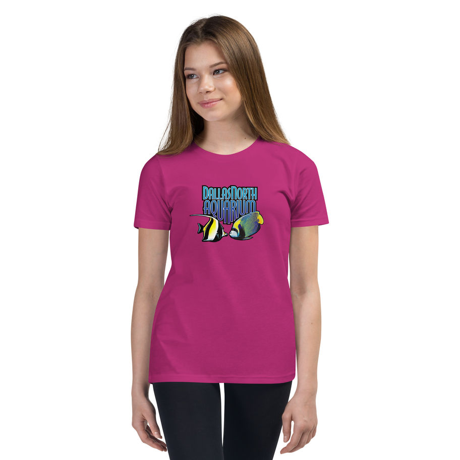 Girl wearing a pink Youth Short Sleeve T-Shirt with Dallas North Aquarium logo featuring two fish