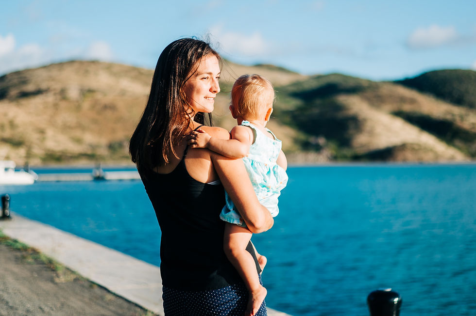 A woman carrying a baby to demonstrate proprioceptive input.