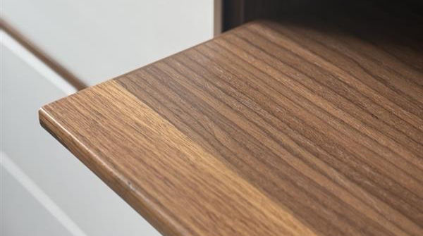 Premium contract furniture surface finishes, including wood veneers, soft-touch laminates, and sustainable fabric samples from LaCOUR's materials collection