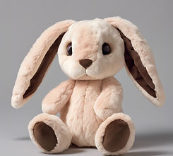 This plush bunny has a light beige body with chocolate-brown spots, including a heart-shap