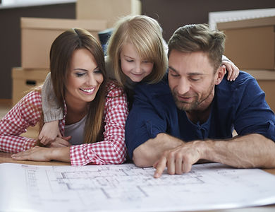 Family looking at home floor plans