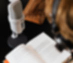 A person recording an audiobook. Maybe they're part of an audiobook production team!