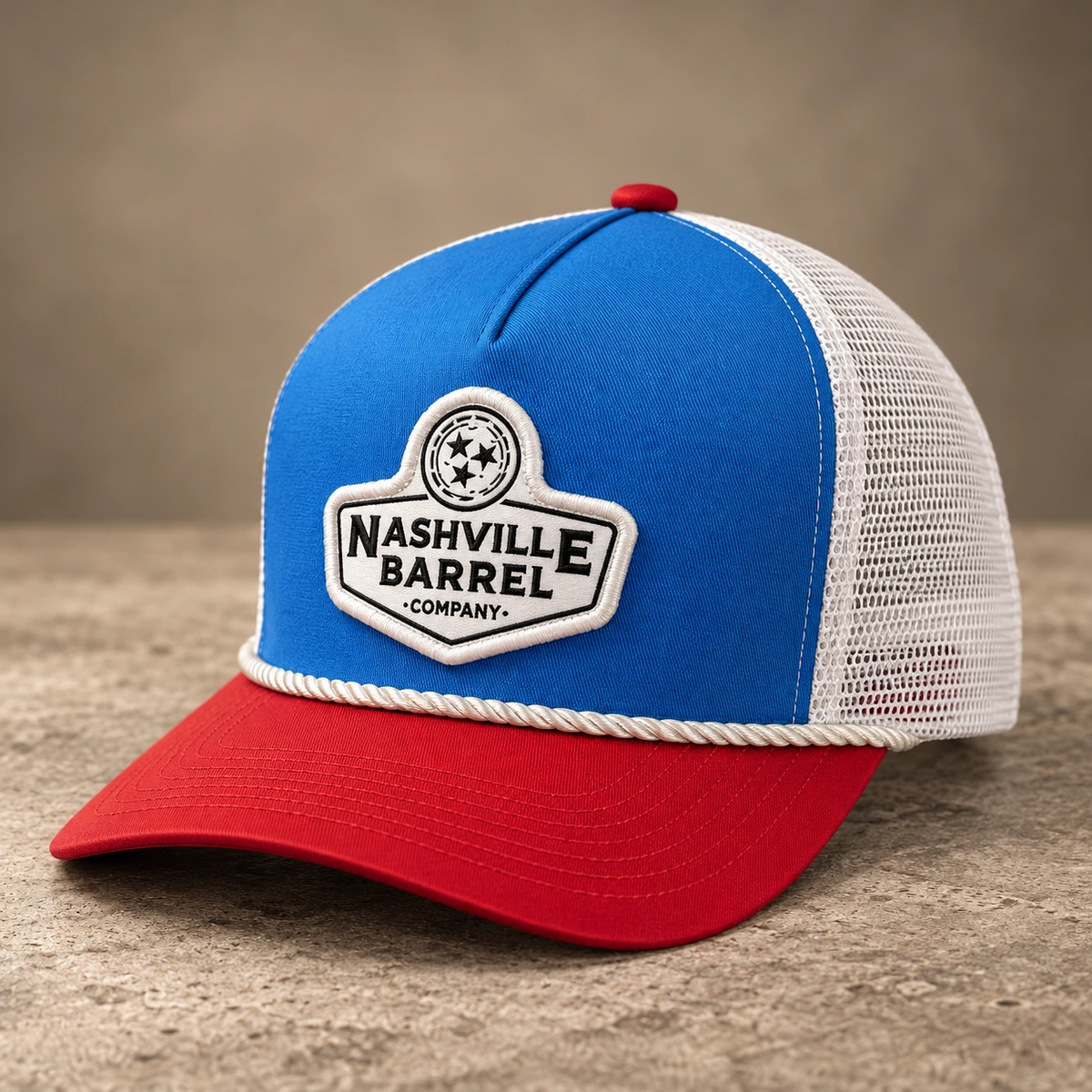 Blue and white mesh custom hat with red brim, fabric patch and white rope