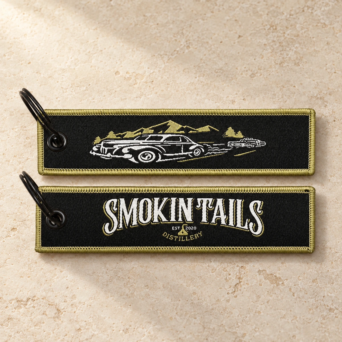 Custom fabric keychains showing front and back artwork