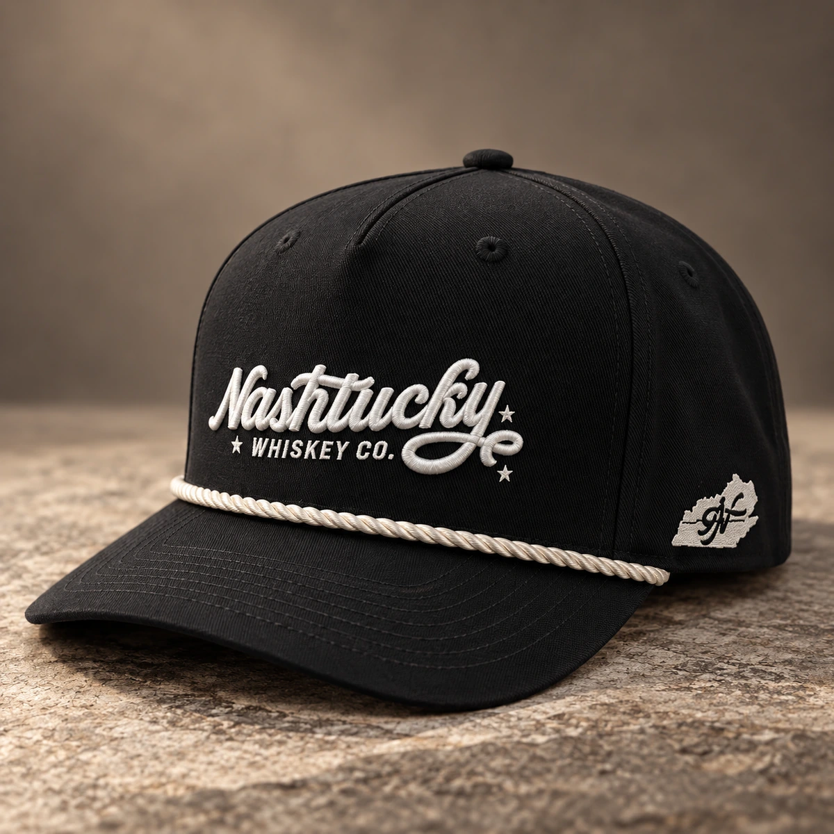 Black custom hat with white embroidered lettering, side embroidery and white rope