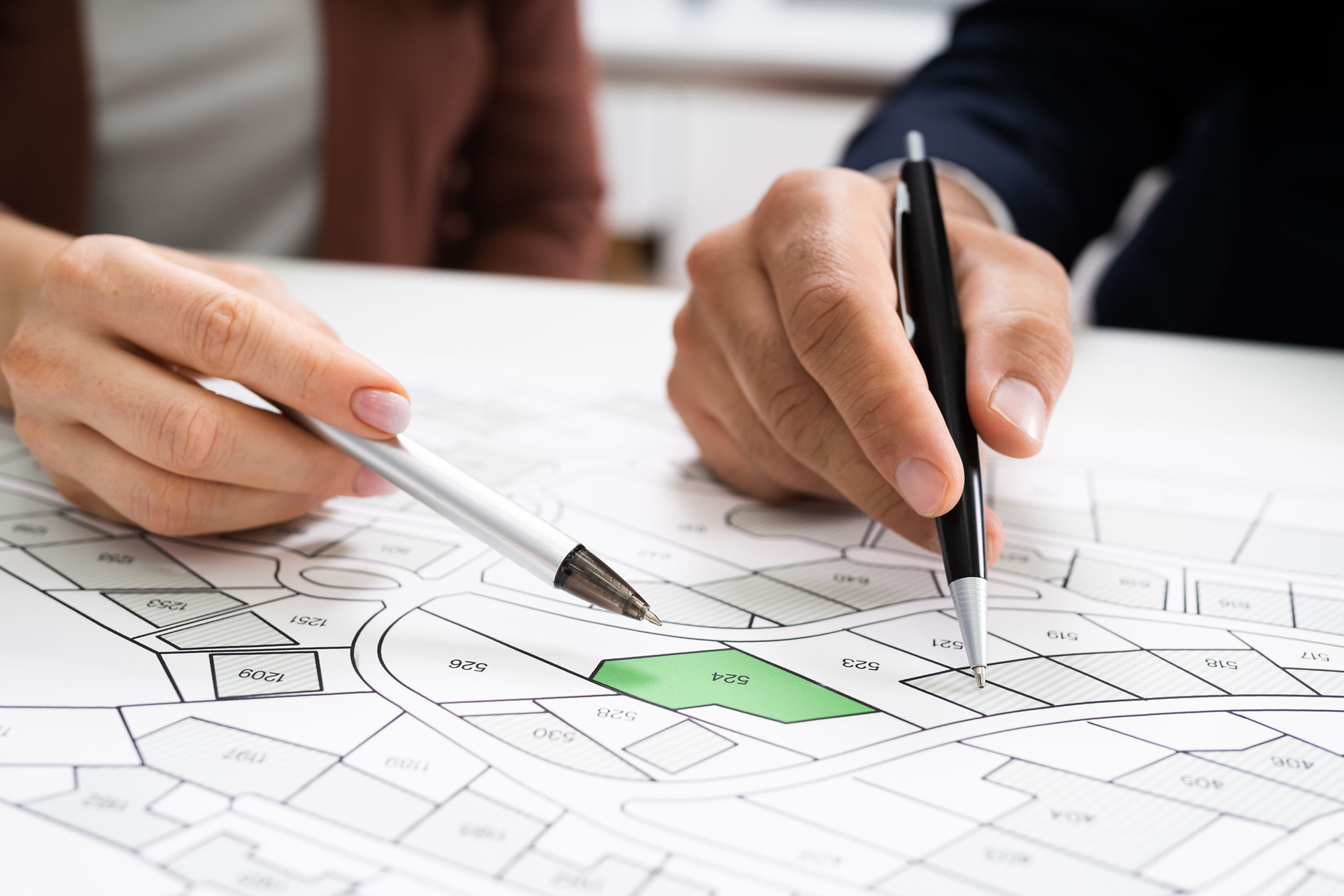 Cadastre Land Map. Cartographer Locating Building Plot.jpg