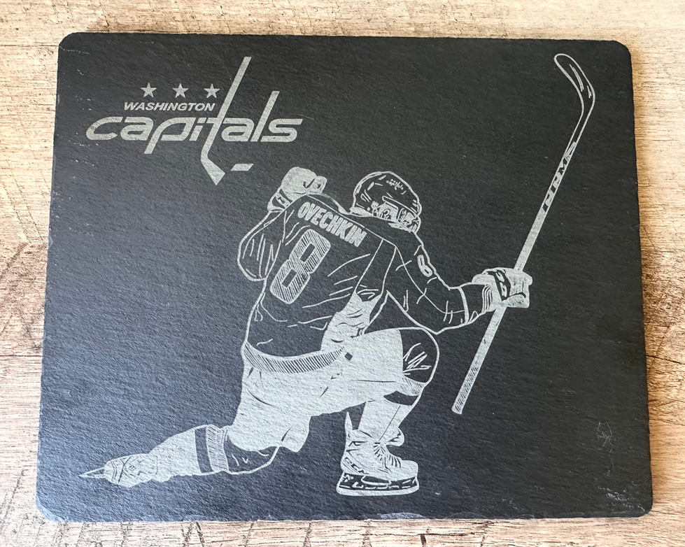 an engraved piece of slate with the capitals logo and ovechkin