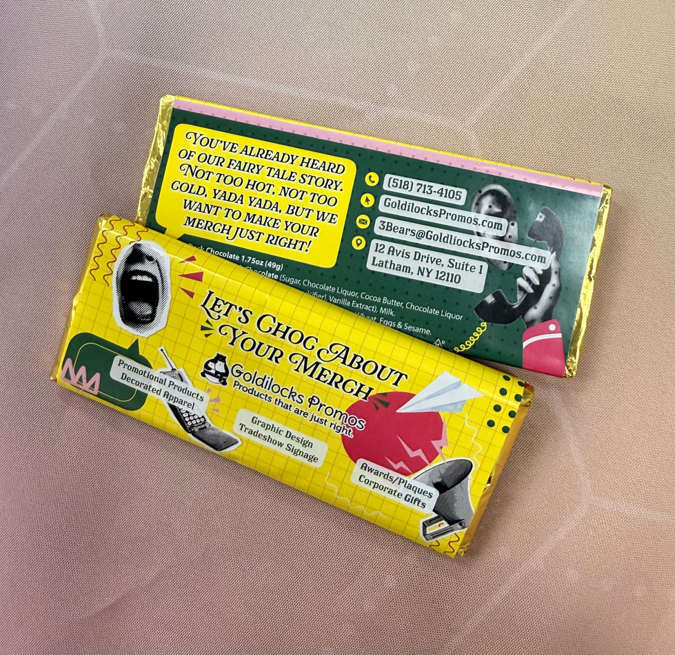 Yellow chocolate bar wrapper that reads "Let's choc about your merch"