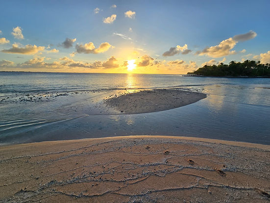Sunset over the lagoon and sandbar at Bokanbotin Island Resort in the Marshall Islands