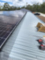 H&B Gutter Cover Project: Solar panels with mesh on metal roof