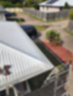 H&B Gutter Cover project on a white metal roof