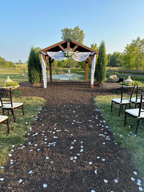 Waterfront view of The Dogwood Gardens for outdoor ceremony in Peculiar Missouri near Kansas City