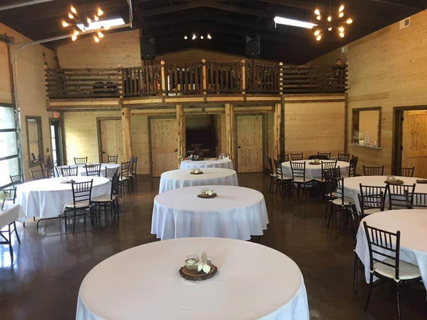 Reception hall setup with round tables at The Dogwood Gardens wedding venue in Peculiar Missouri near Kansas City.