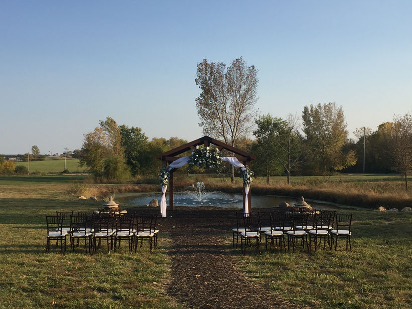 Outdoor waterfront ceremony at The Dogwood Gardens wedding venue and event space in Peculiar Missouri near Kansas City.