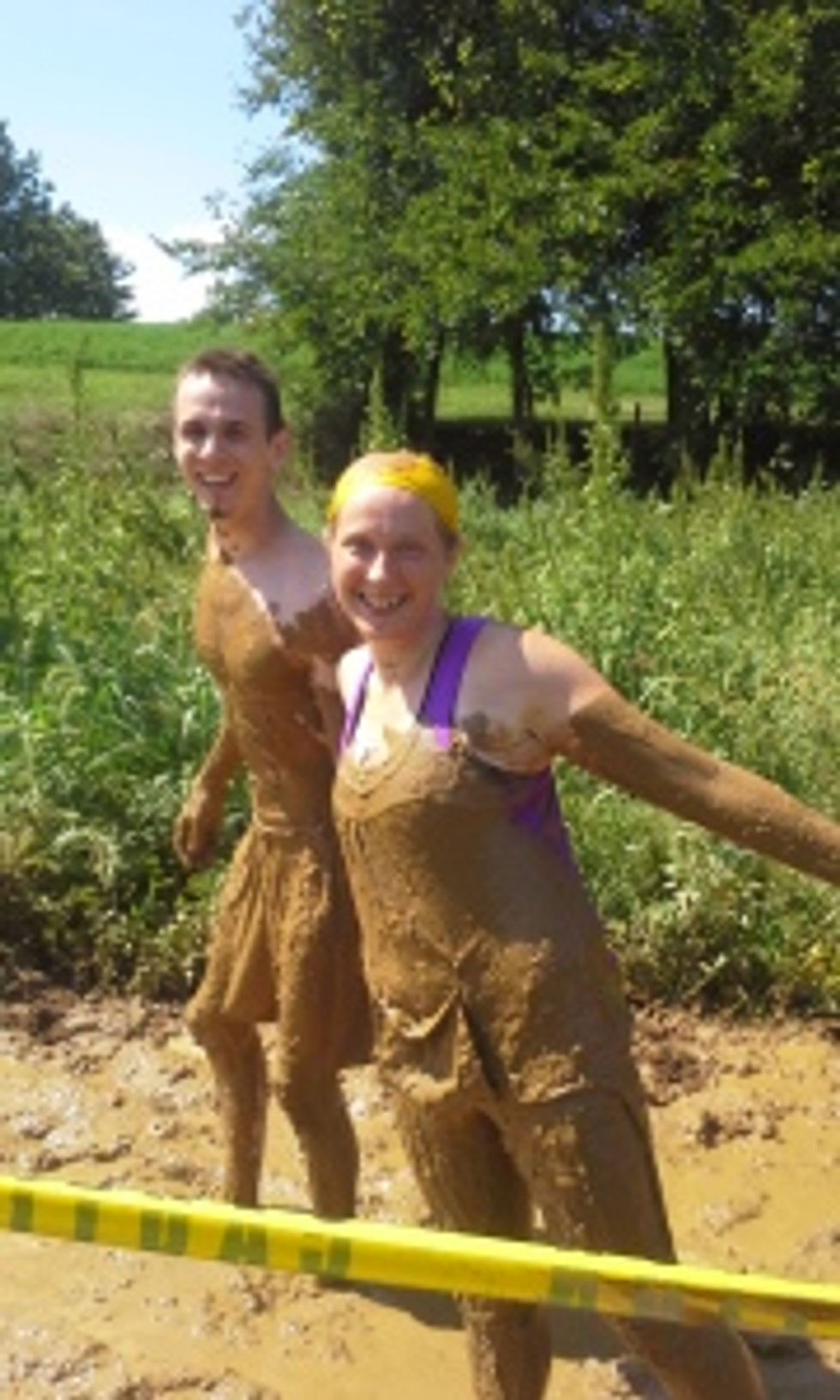 Showing off some well-earned mud.
