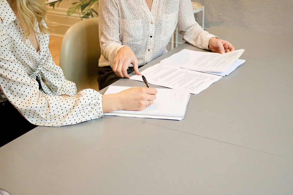 NYC attorney reading over a FSBO home purchase agreement with an investor.