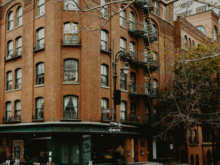 NYC mixed-use property with commercial storefront on the ground floor and residential units above.