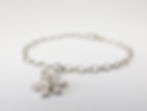 ladies silver chain bracelet with a silver daffodil charm