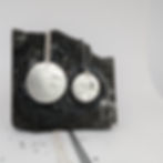 two silver moon pendants on silver necklace chains. one moon is bigger than the other. both moons are circular and have crater textures