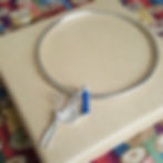 ladies silver bangle with 3 sewing charms, silver scissors, silver bobbin reel, silver button by rock rose jewellery